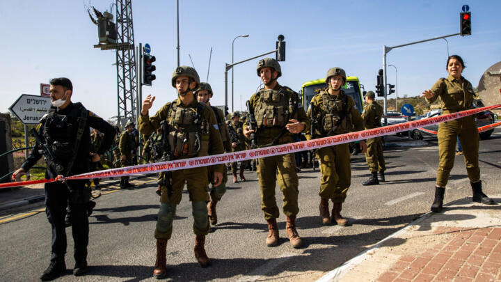Israeli security forces inspect the scene of a stabbing attack in a bus near the Elazar settlement in the occupied West Bank on March 31, 2022.
